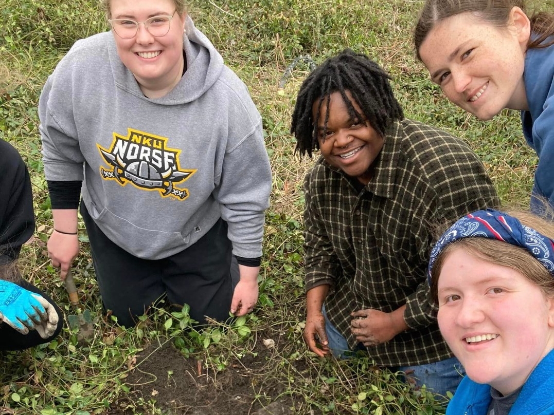Students working at a cemetery